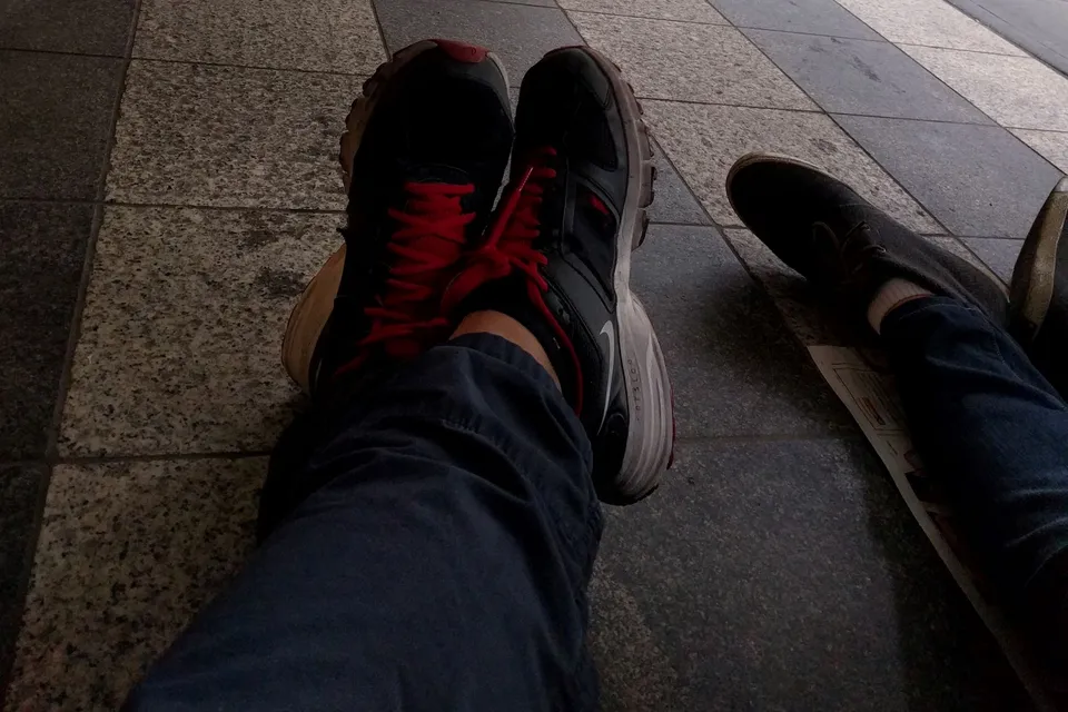 sitting on the ground on the street