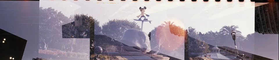 3 shots of street scene overlapping with Micky mouse