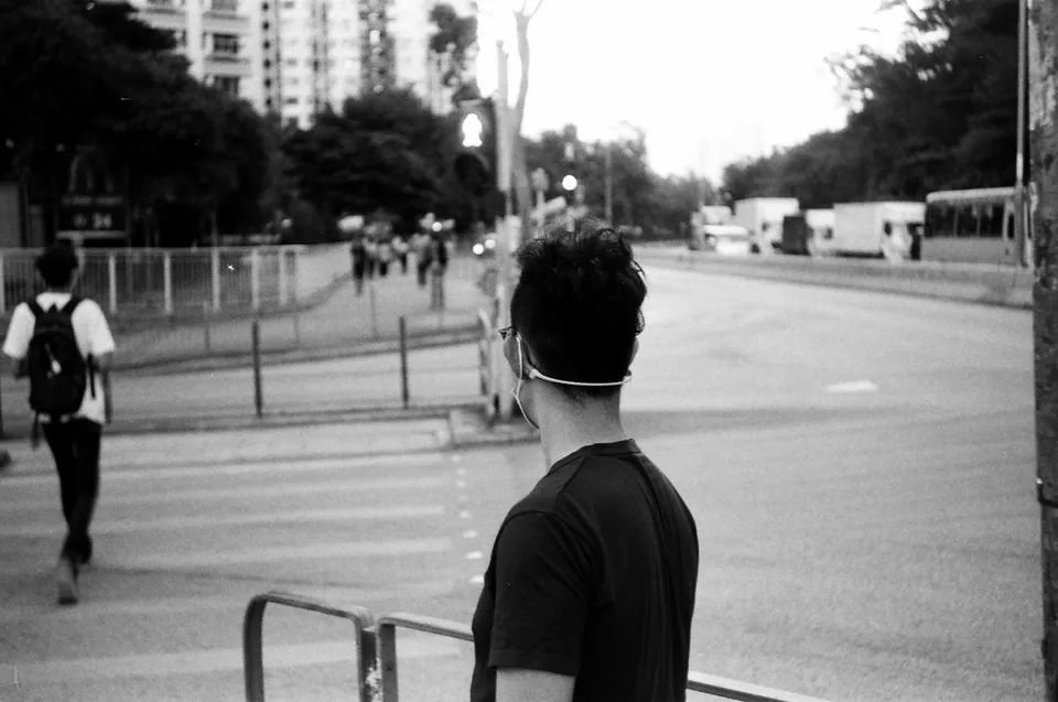 My friend waiting for pedestrian light, in black and white