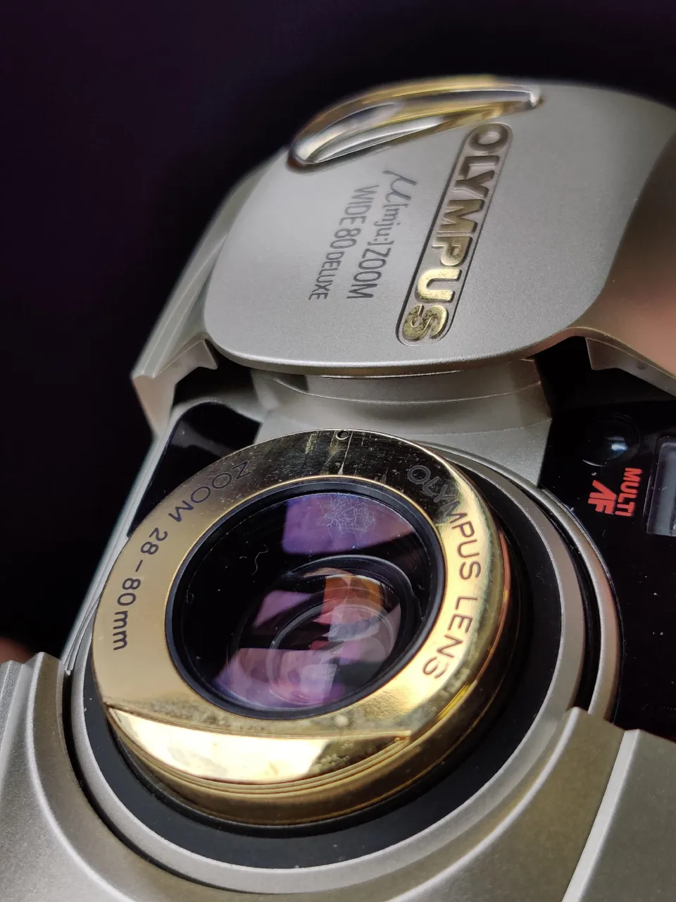 Close-up of the Mju Zoom Deluxe, with fungus on the lens clearly seen